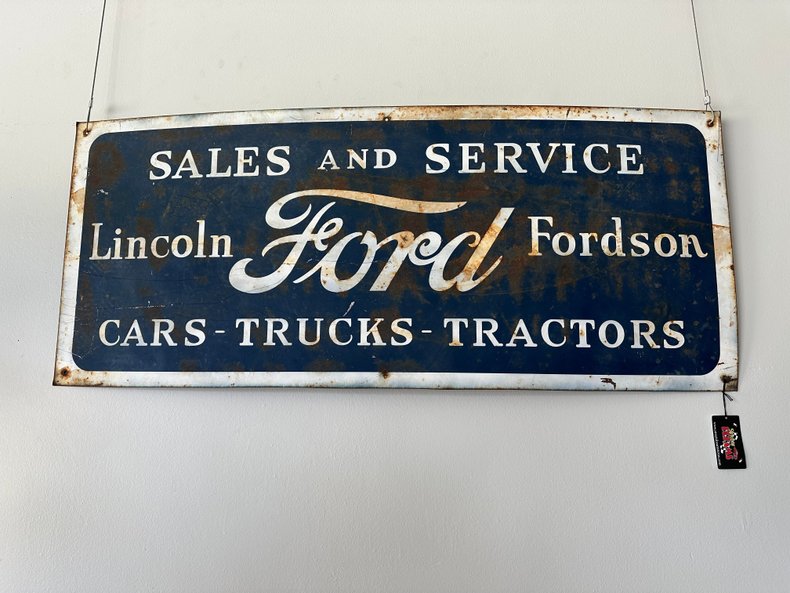 Vintage-style sign for Lincoln Ford Fordson sales and service on a white background